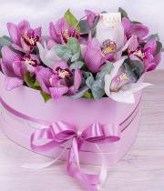 11 white and pink orchids in a heart box